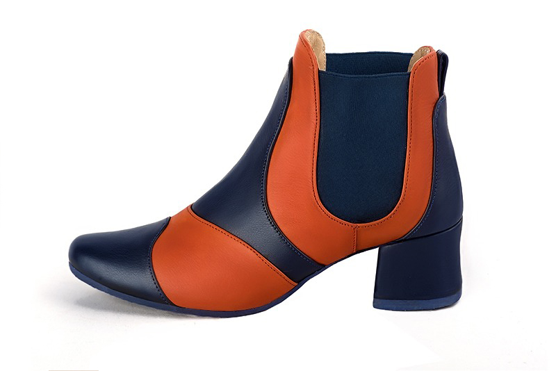 Step out in two-tone leather Chelsea ankle boots with contrasting elastic side gussets for a bold, modern graphic style, in navy blue and orange leather with round toe and low flared heel - Florence KOOIJMAN